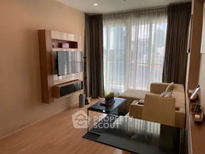 Modern living room with large windows, stylish furniture, and city view.