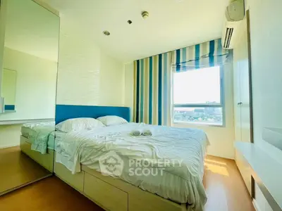 Bright and cozy bedroom with large window and modern decor