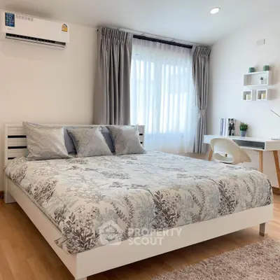 Modern bedroom with stylish decor and natural light