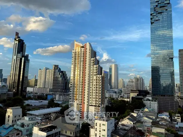 Stunning cityscape view showcasing modern skyscrapers under a clear blue sky, perfect for urban living enthusiasts.