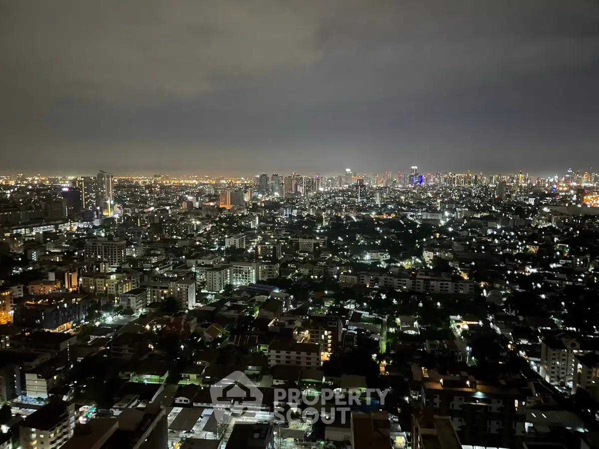 Stunning cityscape night view from high-rise apartment balcony