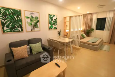 Modern studio apartment with cozy living area and stylish decor