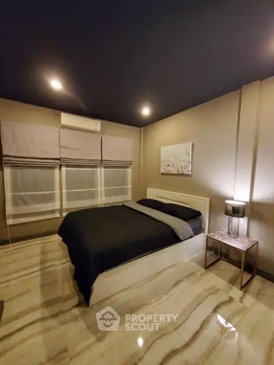 Modern bedroom with stylish decor and ambient lighting