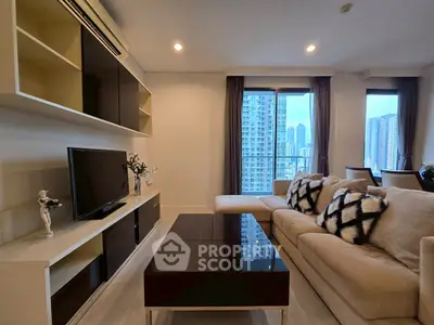 Modern living room with city view, stylish furniture, and elegant decor