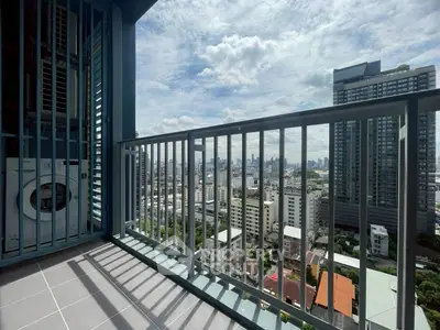 Stunning cityscape view from a modern high-rise balcony with washing machine