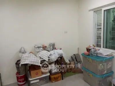 Spacious storage room with organized shelves and natural light from window.