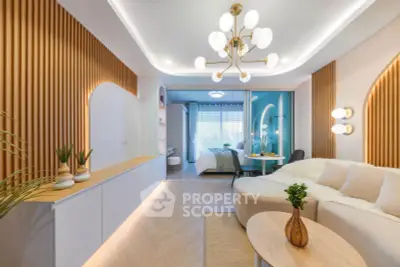Modern living room with stylish decor and open view to bedroom