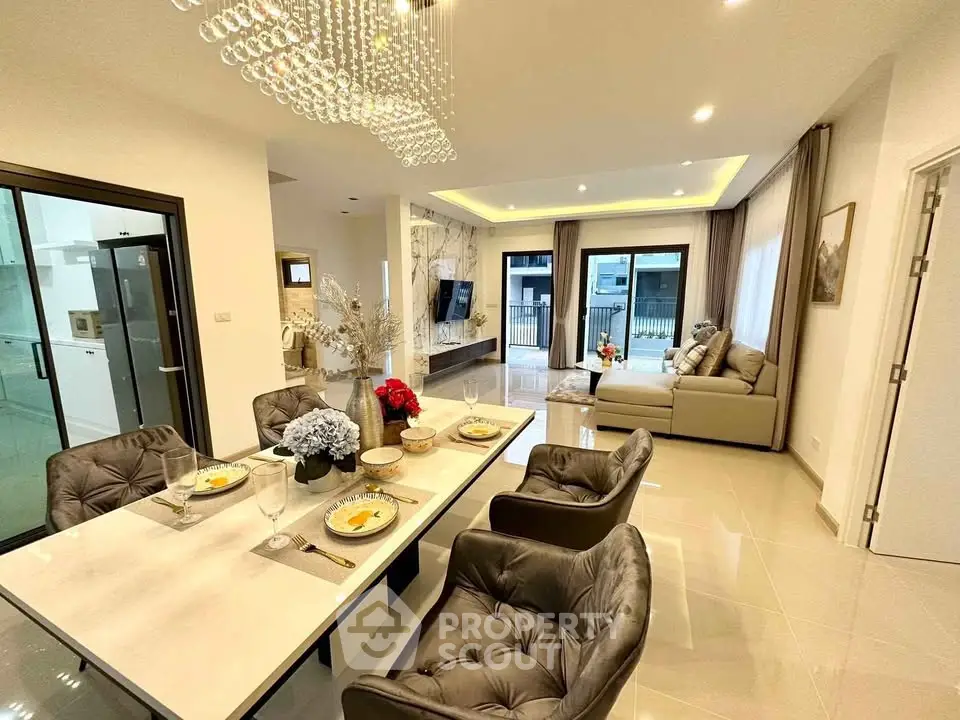 Luxurious open-plan living and dining area with elegant decor and modern furniture.