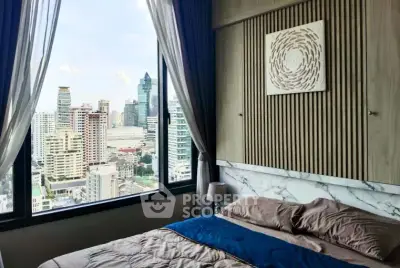 Luxurious bedroom with stunning city view in modern high-rise apartment.