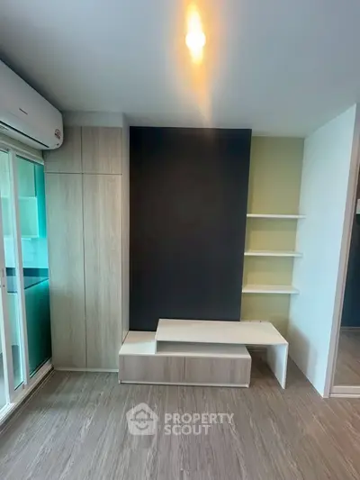 Modern living room with sleek built-in furniture and stylish shelving