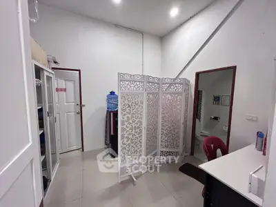 Cozy interior space with decorative room divider and modern furnishings