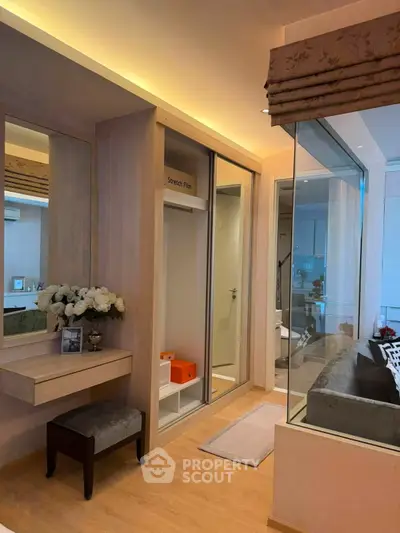 Luxurious modern bedroom with elegant decor and glass partition