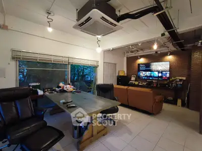 Spacious modern living room with large table and comfortable seating