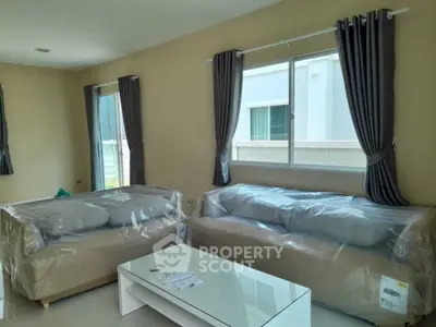 Spacious living room with modern sofas and natural light