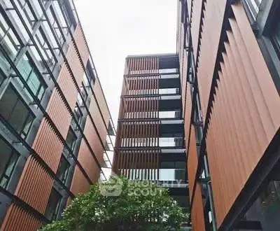 Modern architectural building exterior with sleek design and large windows