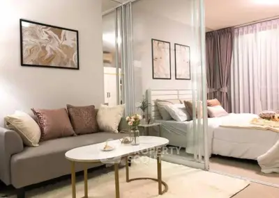 Stylish modern bedroom with cozy living area and elegant decor