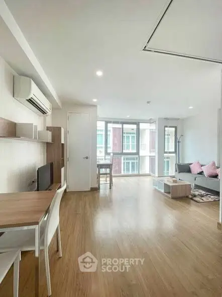 Spacious modern living room with natural light and stylish decor