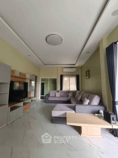 Spacious modern living room with stylish furniture and natural light