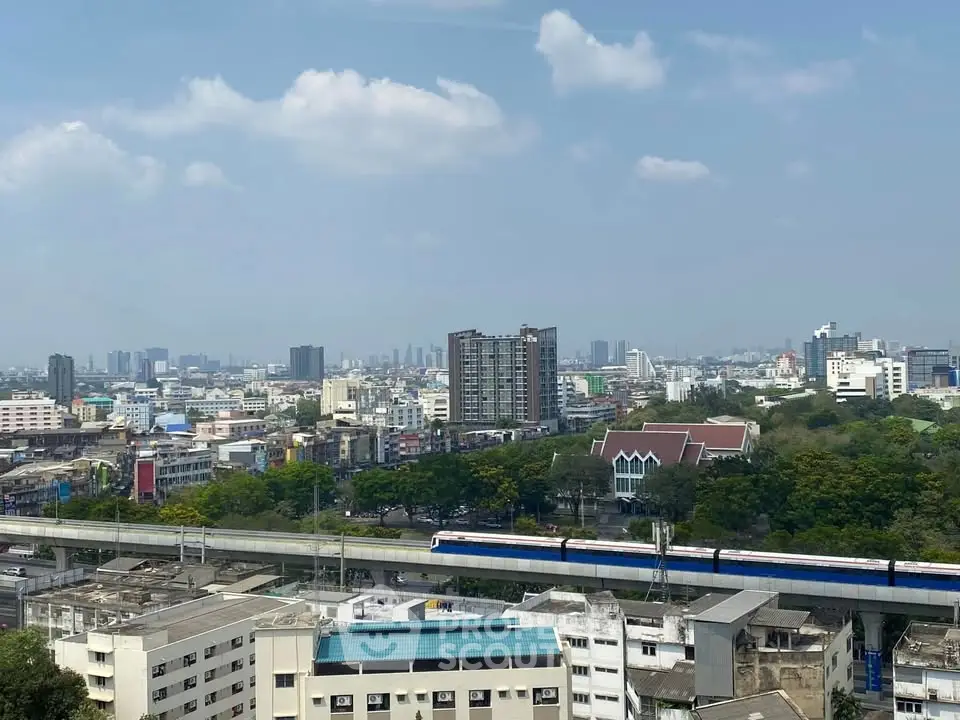 Stunning cityscape view with urban skyline and train, perfect for real estate investment.
