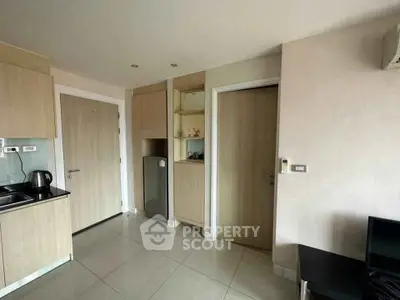 Modern kitchen with sleek cabinetry and compact design in a stylish apartment.