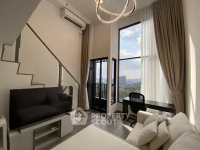 Modern loft apartment with high ceilings and city view from large windows