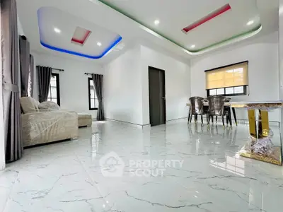 Spacious modern living room with elegant marble flooring and stylish ceiling lights