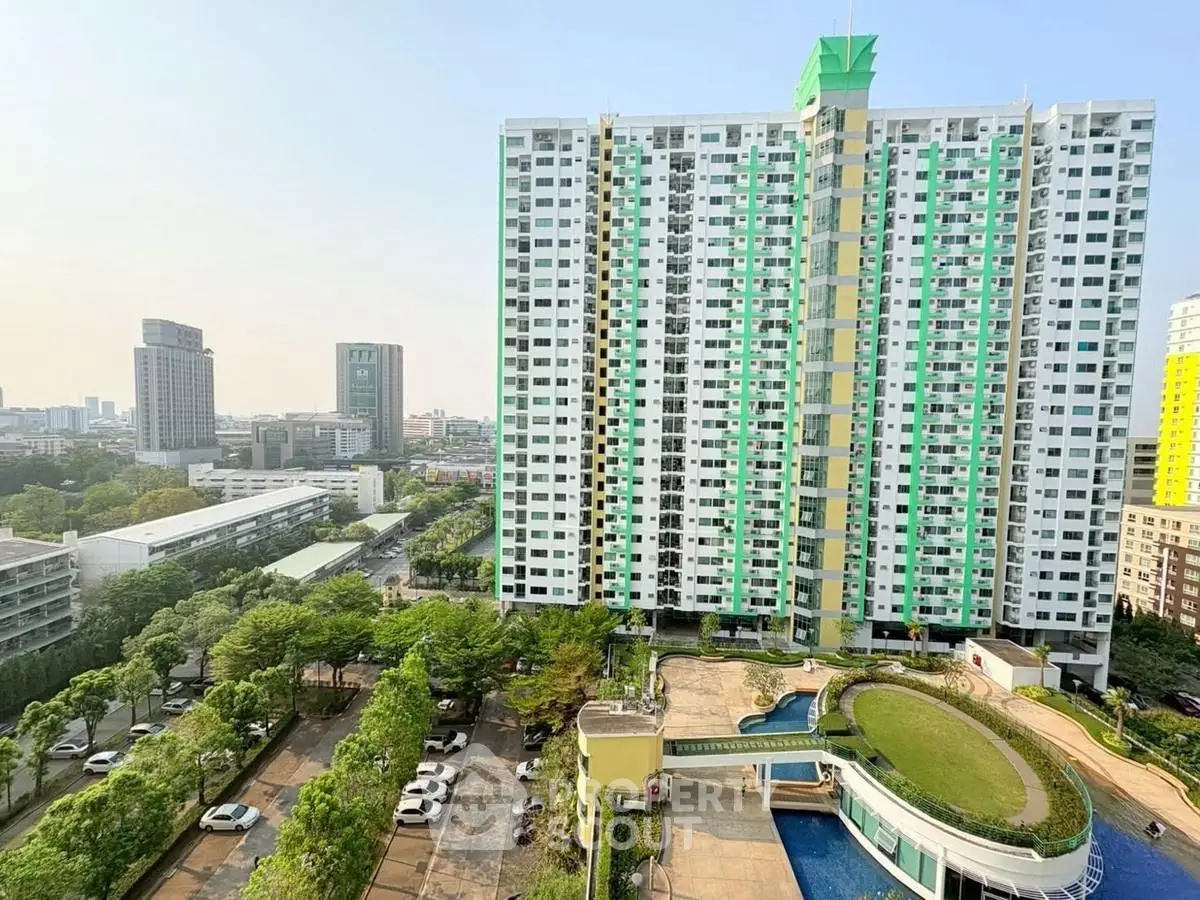 High-rise residential building with pool and city view