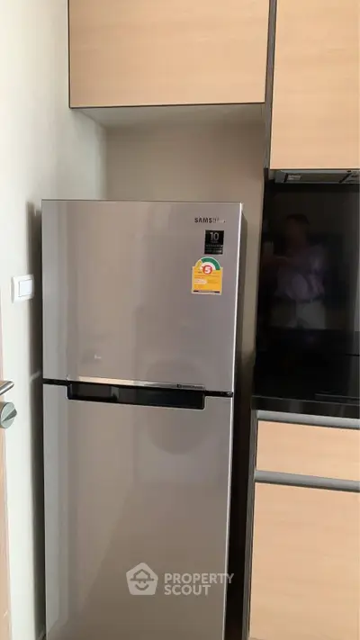 Modern kitchen with sleek Samsung refrigerator and wooden cabinets