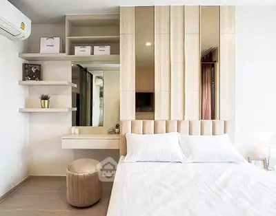 Modern bedroom with stylish decor and built-in storage solutions.