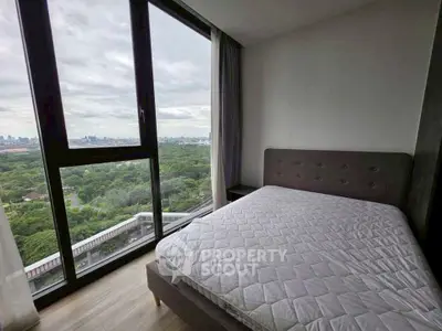 Modern bedroom with panoramic city view and large windows