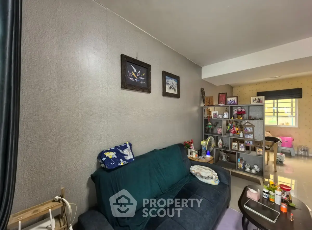 Cozy living room with plush sofa and decorative shelving