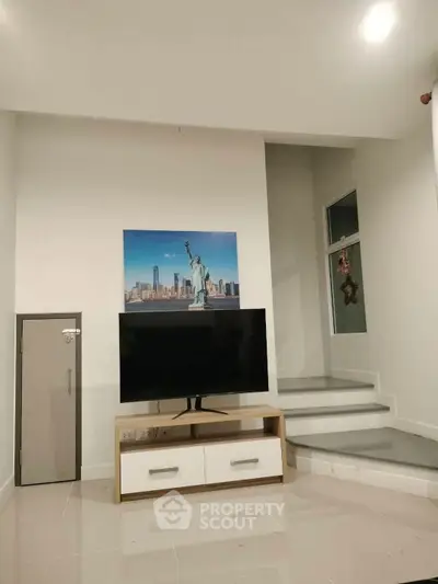 Modern living room with sleek TV unit and stylish decor