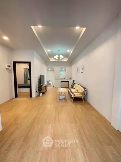 Spacious modern living room with stylish decor and wooden flooring