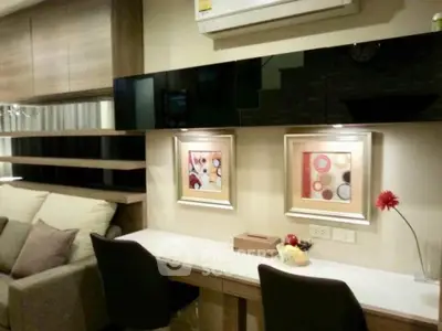 Modern living room with stylish decor and comfortable seating area.