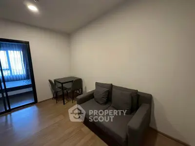 Modern living room with cozy sofa and dining area in a stylish apartment.