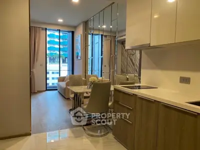 Modern open-plan living room with stylish kitchen and balcony view