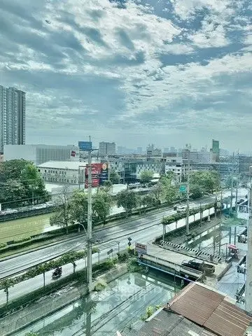 Stunning cityscape view from high-rise building with clear skies and urban landscape.