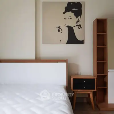 Modern bedroom with stylish wooden furniture and elegant wall art