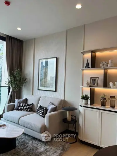 Stylish modern living room with elegant decor and cozy seating area.