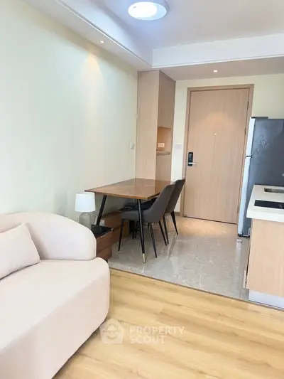 Modern living room with cozy sofa and dining area in stylish apartment