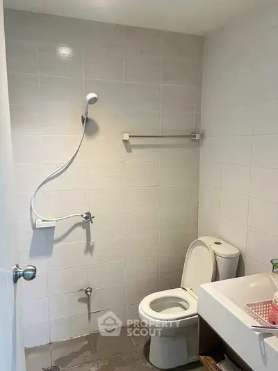 Minimalist bathroom with shower and toilet in modern apartment