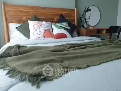 Cozy bedroom with stylish wooden headboard and modern decor