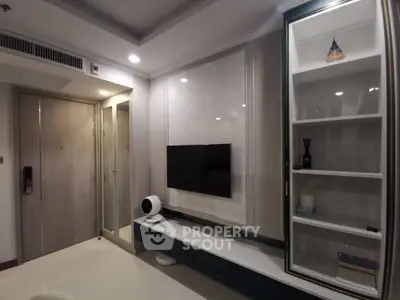 Modern living room with sleek TV setup and stylish storage
