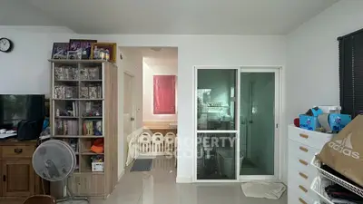 Cozy living space with modern decor and ample storage, perfect for family living.