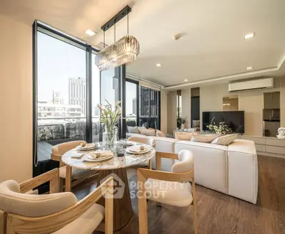 Luxurious open-plan living room with elegant dining area and city view, featuring modern decor and ample natural light.