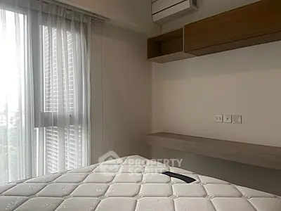 Modern bedroom with natural light and minimalist design