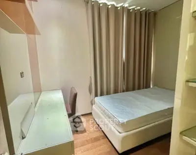 Cozy bedroom with modern furnishings and natural light