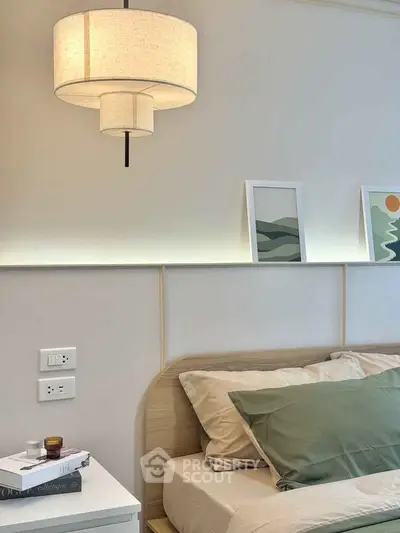 Modern bedroom with stylish lighting and minimalist decor
