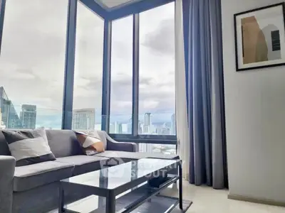 Modern living room with panoramic city view and stylish decor