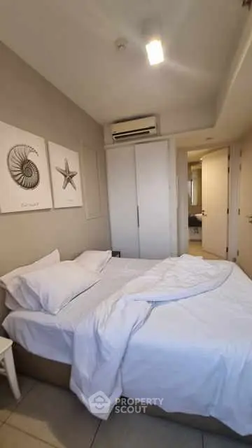 Cozy bedroom with modern decor and air conditioning unit